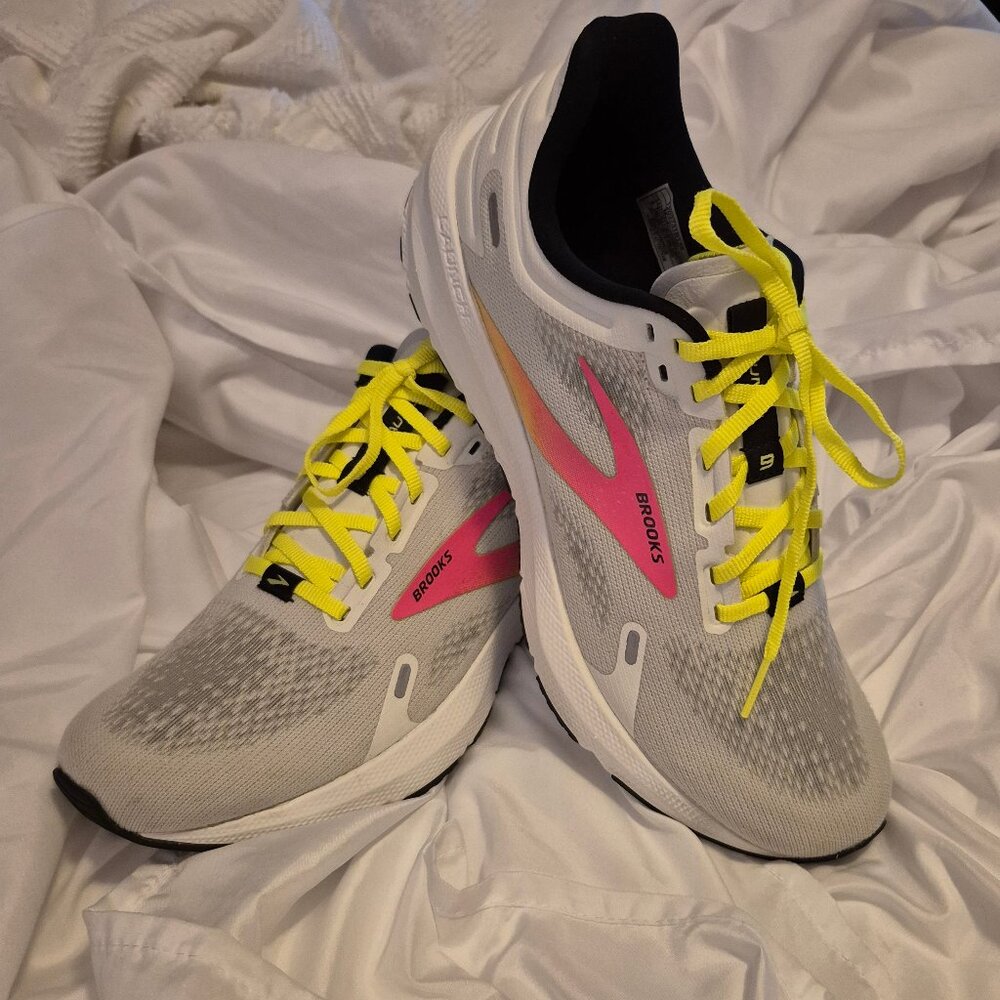 Brooks Athletic Shoes. size 9M.  White ,pink, with yellow strings.